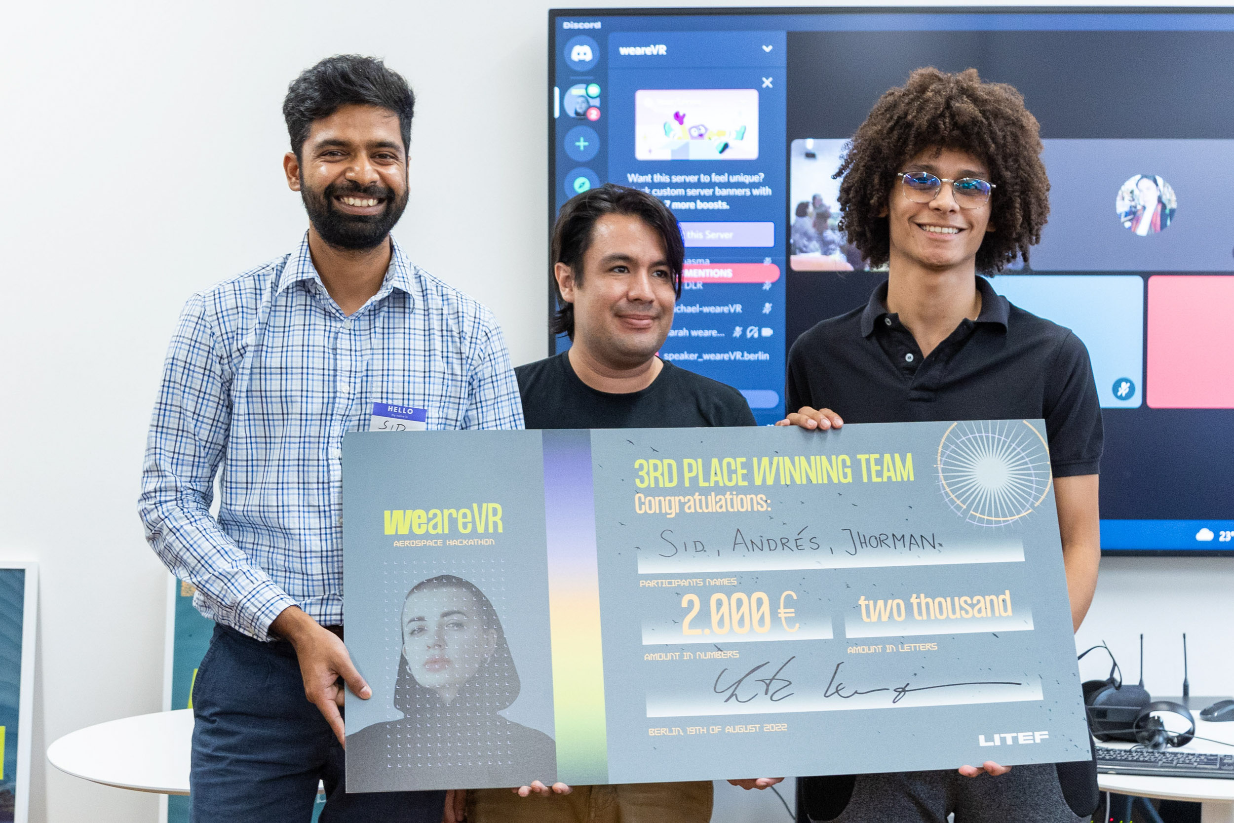 weareVR Aerospace Hackathon winning start-ups teams holding check LITEF