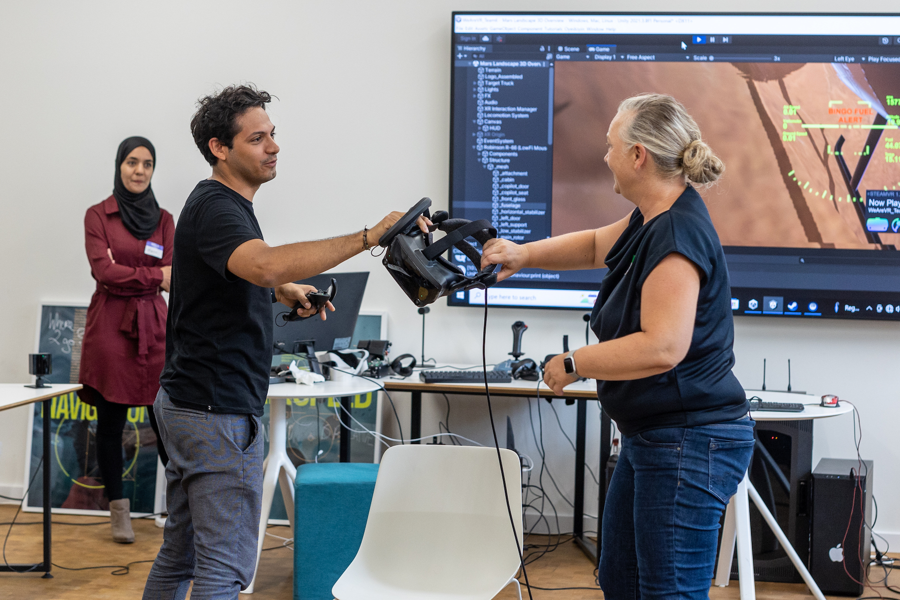 weareVR Aerospace Hackathon winning start-ups teams handing Oculus 